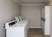 Thumbnail 32 of 32 - Laundry Room at La Bella Apartments, Fort Worth