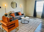 Thumbnail 4 of 32 - a living room with a couch and a coffee table at La Bella Apartments, Fort Worth, 76116