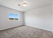 Thumbnail 21 of 74 - A room with a window and a ceiling light. at Red Rock Apartments, South Dakota 57702