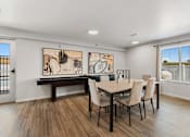 Thumbnail 43 of 74 - a dining room with a table and chairs and a window at Red Rock Apartments, Rapid City, SD