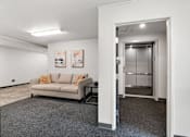 Thumbnail 40 of 74 - a living room with a couch and a glass door at Red Rock Apartments, Rapid City, 57702