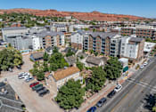 Thumbnail 3 of 35 - an aerial view of apartments in a city with a mountain in the background at City View St. George Apartments, Utah, 84770