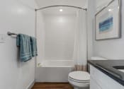 Thumbnail 34 of 35 - a bathroom with a shower and a toilet and a sink at City View St. George Apartments, St George, Utah