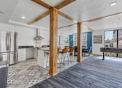 Thumbnail 13 of 35 - an open kitchen and dining area with a bar and a pool table at City View St. George Apartments, St George