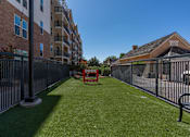 Thumbnail 22 of 35 - the yard is fenced in with a table and chairs on the grass at City View St. George Apartments, St George, Utah