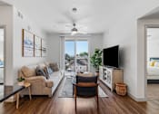 Thumbnail 28 of 35 - a living room with a couch and a chair and a tv at City View St. George Apartments, St George, UT, 84770