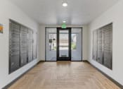 Thumbnail 25 of 35 - a hallway with lockers and a door to a building at City View St. George Apartments, St George, Utah