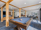 Thumbnail 14 of 35 - a pool table in the clubhouse of a home with a living room at City View St. George Apartments, St George, UT