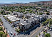 Thumbnail 2 of 35 - an aerial view of a city with buildings and cars on the street at City View St. George Apartments, St George