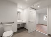 Thumbnail 90 of 92 - A white toilet is in a small bathroom with a white door at AVIA Lofts on Parkway Apartments, Washington, 98662