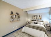 Thumbnail 19 of 51 - A bedroom with a large bed and a shelf with decorative items.