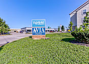 Thumbnail 35 of 45 - A sign for Fairfield Apartments is displayed in front of a building.