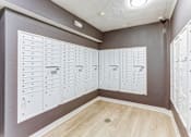 Thumbnail 25 of 45 - A room with a wall of lockers and a list of names on the wall.