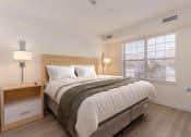 Thumbnail 105 of 108 - a bedroom with a bed and a window