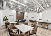 Thumbnail 5 of 55 - A conference room with a long table surrounded by chairs.