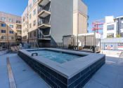 Thumbnail 10 of 84 - amenities include a pool and spa on the roof of a building at The Revival, Salt Lake City, Utah