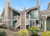 Thumbnail 4 of 92 - A green and beige two story house with a front yard. at AVIA Lofts on Parkway Apartments, Vancouver, Washington