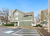 Thumbnail 3 of 92 - A parking lot with a blue painted handicap spot. at AVIA Lofts on Parkway Apartments, Vancouver, 98662