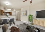 Thumbnail 15 of 46 - a living room with a couch a table and a tv at Siena Villas Apartments, Orem