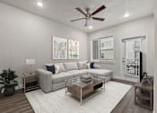 Thumbnail 133 of 136 - A living room with a grey couch, a glass coffee table, and a ceiling fan.