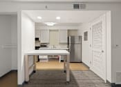 Thumbnail 79 of 92 - A kitchen with white cabinets and a refrigerator. at AVIA Lofts on Parkway Apartments, Vancouver, WA