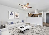 Thumbnail 1 of 74 - a living room with white couches and a coffee table at Red Rock Apartments, Rapid City, South Dakota