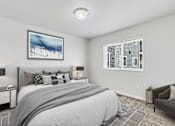 Thumbnail 22 of 74 - a bedroom with a large bed and two windows at Red Rock Apartments, Rapid City, SD, 57702
