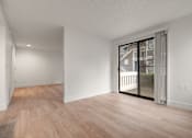 Thumbnail 86 of 92 - A room with wooden floors and white walls at AVIA Lofts on Parkway Apartments, Vancouver, WA