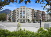 Thumbnail 5 of 83 - an empty street in front of an apartment building with a mountain in the background at 200 City View, Provo, UT, 84601
