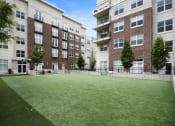 Thumbnail 24 of 83 - a large grassy area with trees in front of an apartment building at 200 City View, Provo, UT