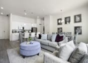 Thumbnail 53 of 83 - a living room with a couch and a chair at 200 City View, Provo