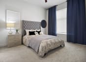 Thumbnail 57 of 83 - a bedroom with a bed and a dresser at 200 City View, Provo, 84601