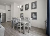 Thumbnail 59 of 83 - a dining room with a table and chairs at 200 City View, Provo