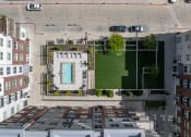 Thumbnail 8 of 83 - an aerial view of a building with green turf and a blue door on the roof at 200 City View, Provo, 84601