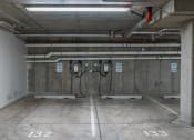 Thumbnail 27 of 83 - a room in a parking garage with pipes on the wall at 200 City View, Provo