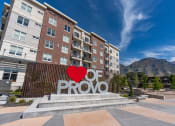 Thumbnail 2 of 83 - a large red love heart sculpture in front of a building with the word roo at 200 City View, Provo