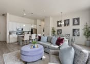 Thumbnail 73 of 83 - an open living room and kitchen with a couch and a table at 200 City View, Provo, 84601