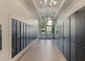 Thumbnail 72 of 83 - a long hallway with lockers and a door at 200 City View, Provo, UT