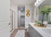 Thumbnail 70 of 83 - a bathroom with a shower and a sink and a mirror at 200 City View, Provo