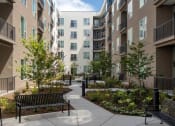 Thumbnail 54 of 126 - Courtyard with benches ground level at SevenO2 Main Apartments, Salt Lake City, UT