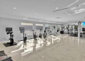 Thumbnail 20 of 41 - a gym with cardio machines and weights in a large room