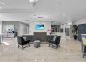 Thumbnail 11 of 41 - a lobby with a reception desk and chairs