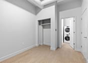 Thumbnail 41 of 55 - A laundry room with a washer and dryer.