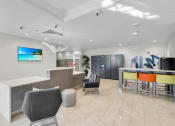 Thumbnail 9 of 41 - a lobby with a bar and chairs and a table with chairs