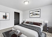 Thumbnail 20 of 74 - a bedroom with a large bed in a 555 waverly unit at Red Rock Apartments, Rapid City, SD