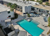 Thumbnail 3 of 41 - an aerial view of a swimming pool in front of a building