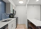 Thumbnail 50 of 61 - kitchen with sink and stove and counter top at AVIA Lofts on Liberty Ridge, Jacksonville, FL, 32256