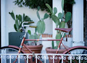 Thumbnail 40 of 61 - A red bicycle is parked at Bautista Apartments, Tucson, 85745