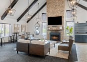 Thumbnail 4 of 50 - a living room with couches chairs and a fireplace