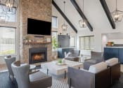 Thumbnail 6 of 50 - a living room with couches a coffee table and a fireplace